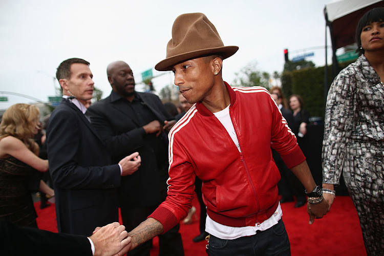 LOS ANGELES, CA - JANUARY 26:  Recording artist Pharrell Williams and Helen Lasichanh attend the 56th GRAMMY Awards at Staples Center on January 26, 2014 in Los Angeles, California.  (Photo by Christopher Polk/Getty Images for NARAS)